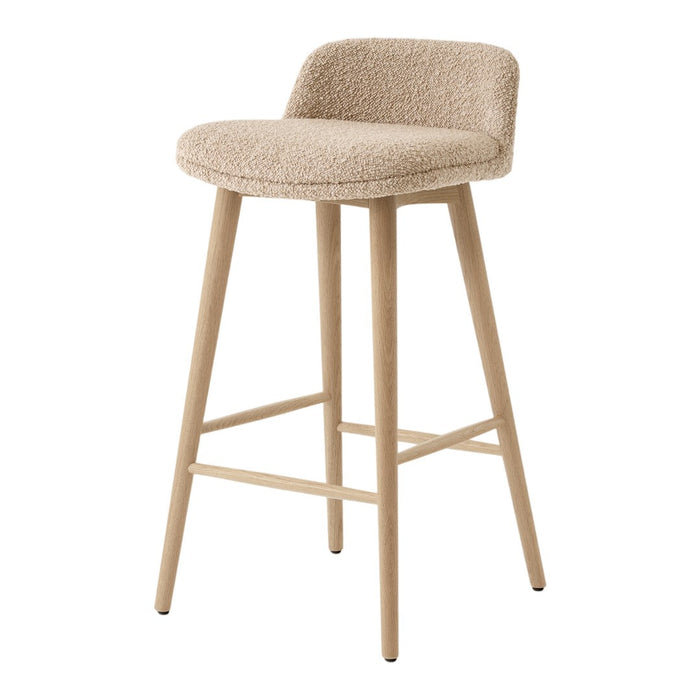 Beige upholstered bar stool with light wooden legs, featuring a smooth, minimalist design.
