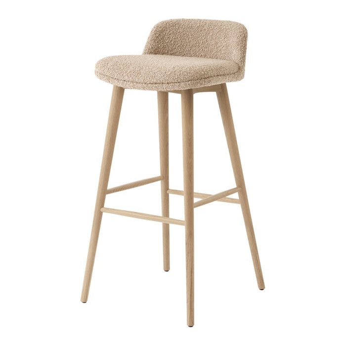 Beige upholstered bar stool with a soft, textured surface and natural wooden legs.