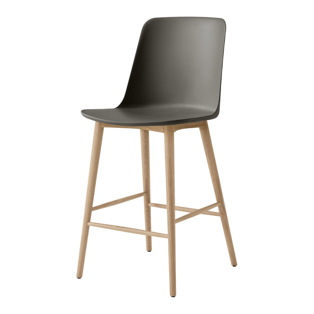 Modern gray bar stool with a sleek design, featuring a matte finish and light wooden legs. Perfect for contemporary decor.
