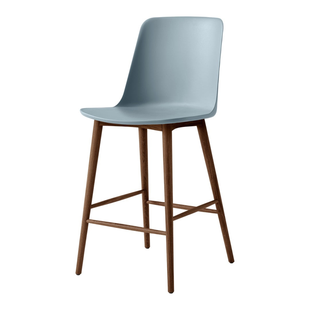 Light blue molded chair with natural wood legs, minimalist design, ideal for modern spaces.