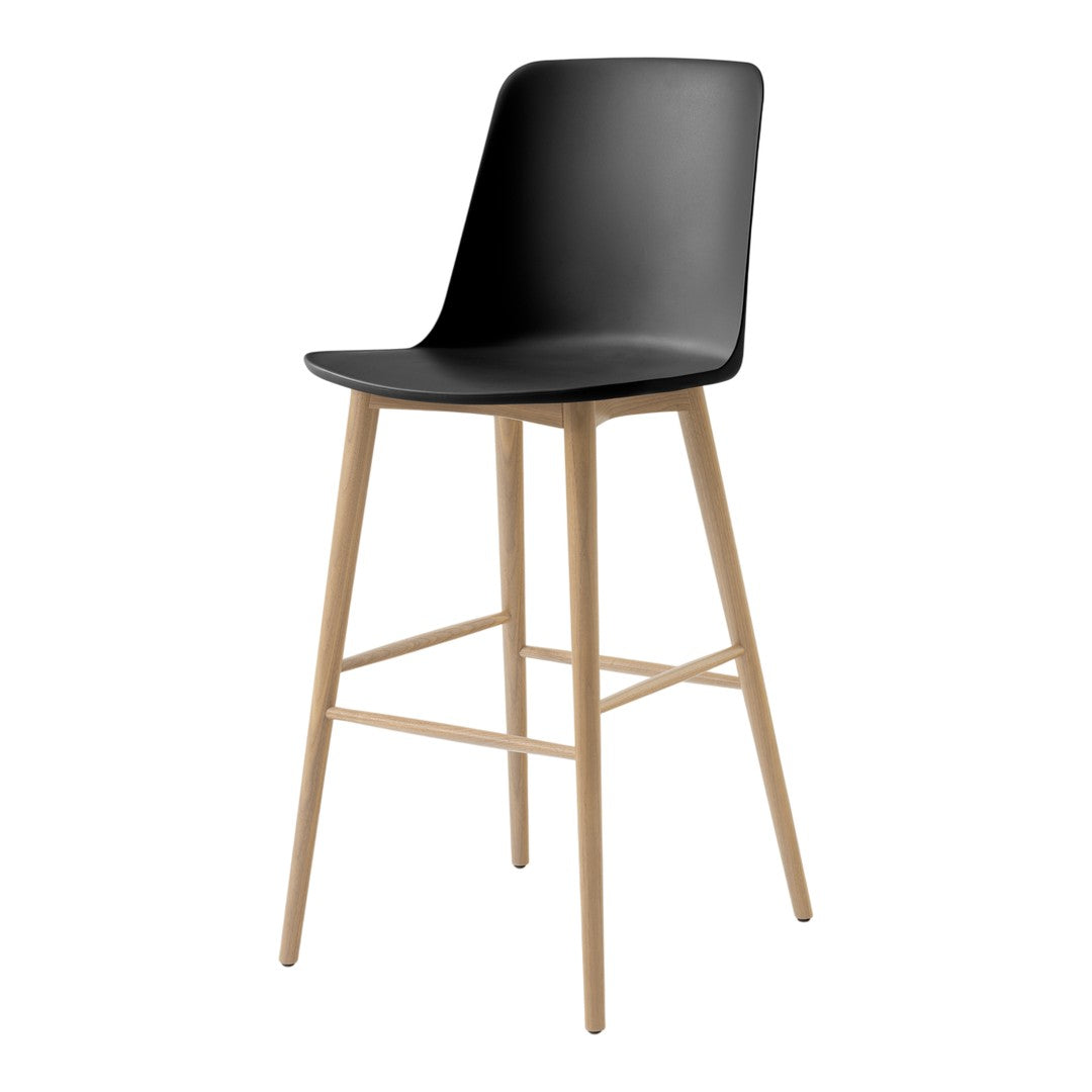 Black bar stool with a sleek, curved seat and natural wooden legs for a modern, minimalist look.