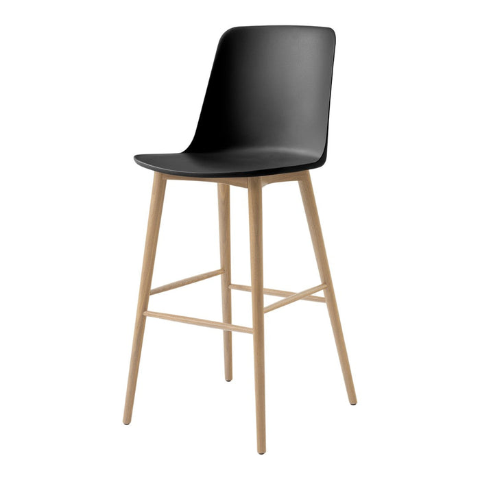 Black bar stool with a sleek, curved seat and natural wooden legs for a modern, minimalist look.