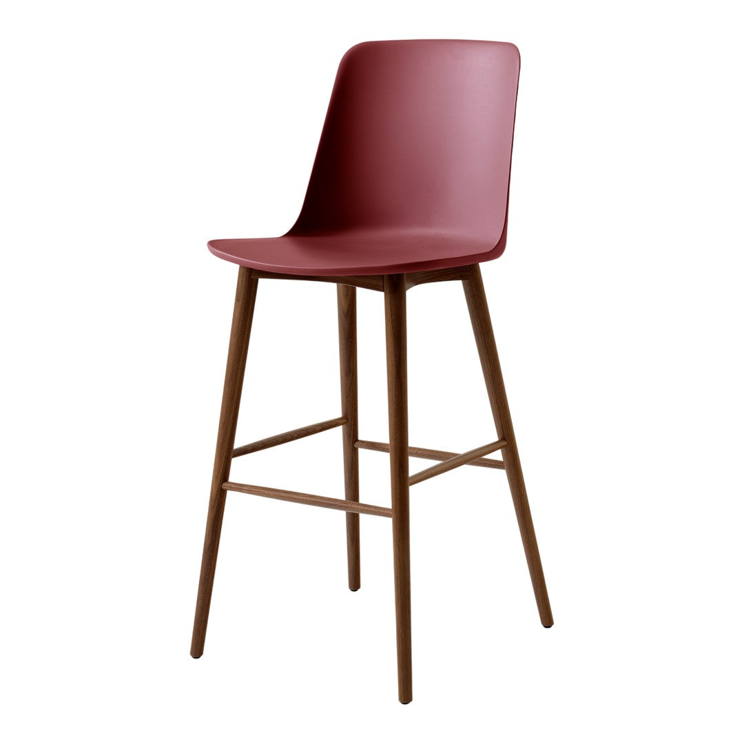 Modern maroon bar stool with a sleek design and natural wood legs, perfect for stylish interiors.