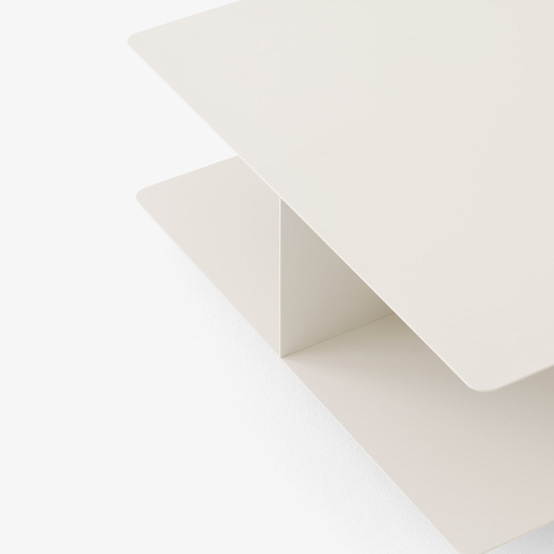 Minimalist light cream coffee table with smooth edges and a sleek, modern design. Perfect for contemporary spaces.