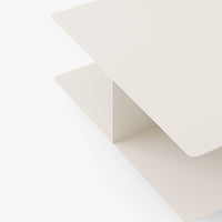 Minimalist light cream coffee table with smooth edges and a sleek, modern design. Perfect for contemporary spaces.