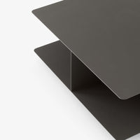 Sleek dark gray metal shelf with a minimalist design and smooth, matte finish. Perfect for modern decor.