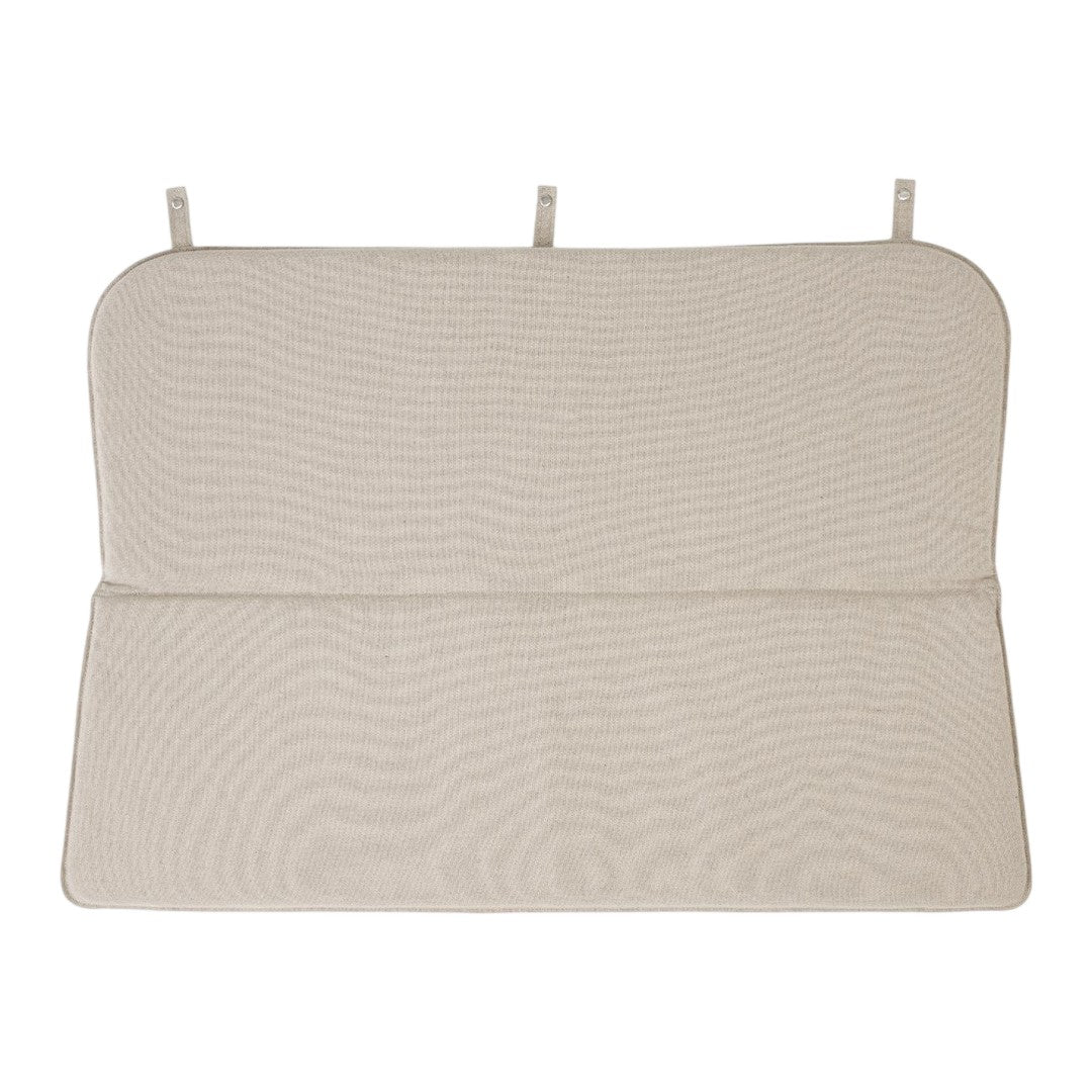 Beige textured mat with subtle wave pattern and two hanging straps for secure placement.