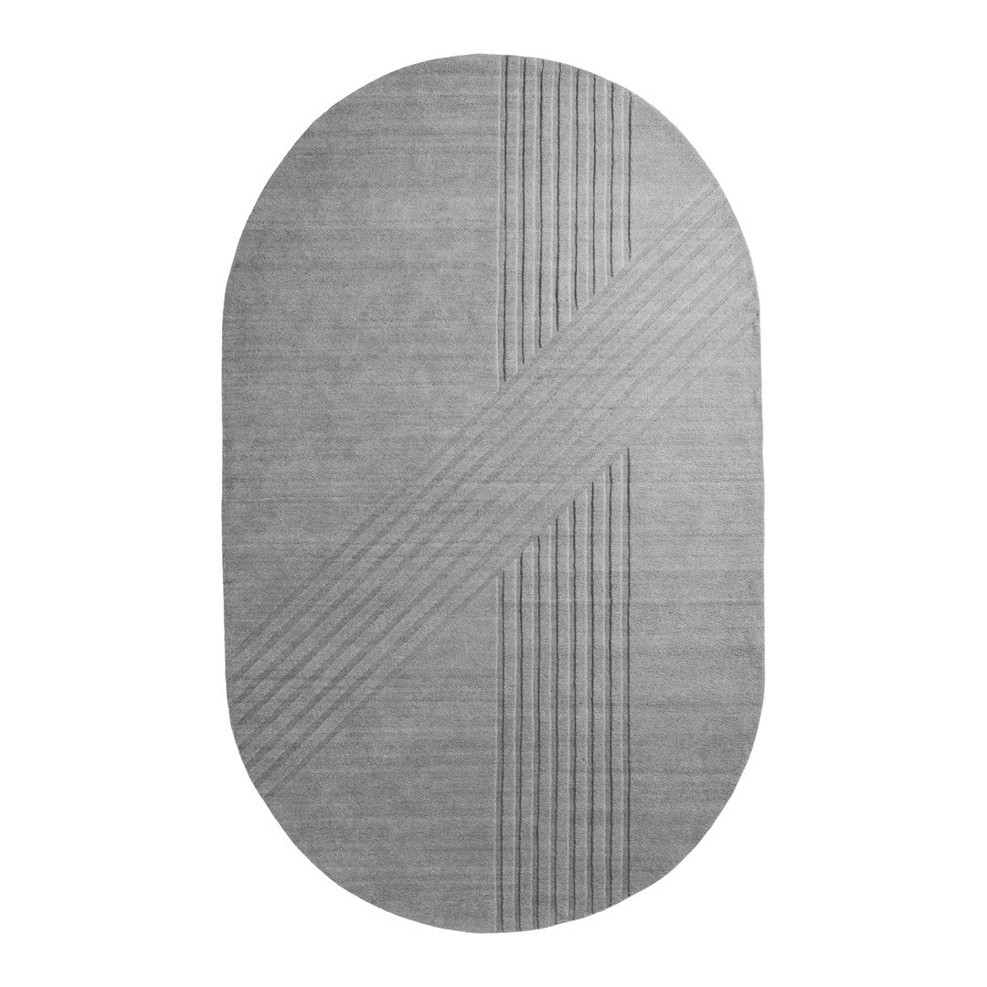 Gray oval rug featuring textured stripes and geometric patterns for modern home decor.
