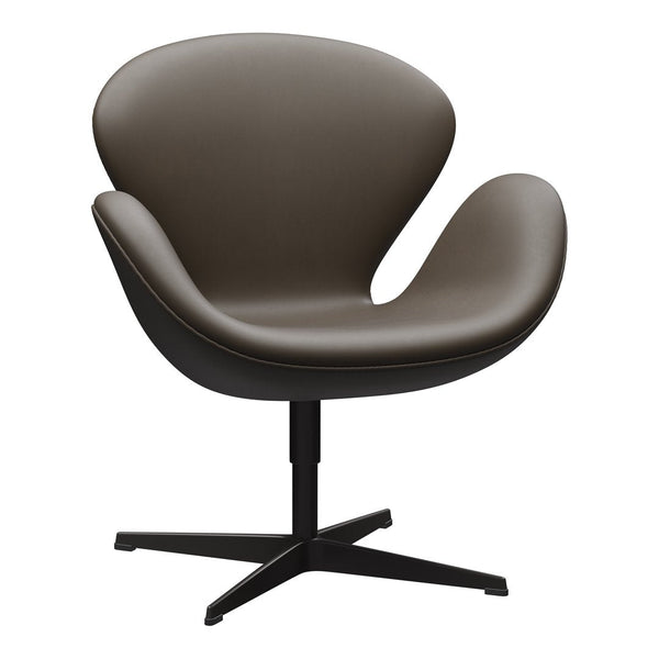 Brown leather chair with smooth, curved contours and a black metal base, showcasing a modern, minimalist design.