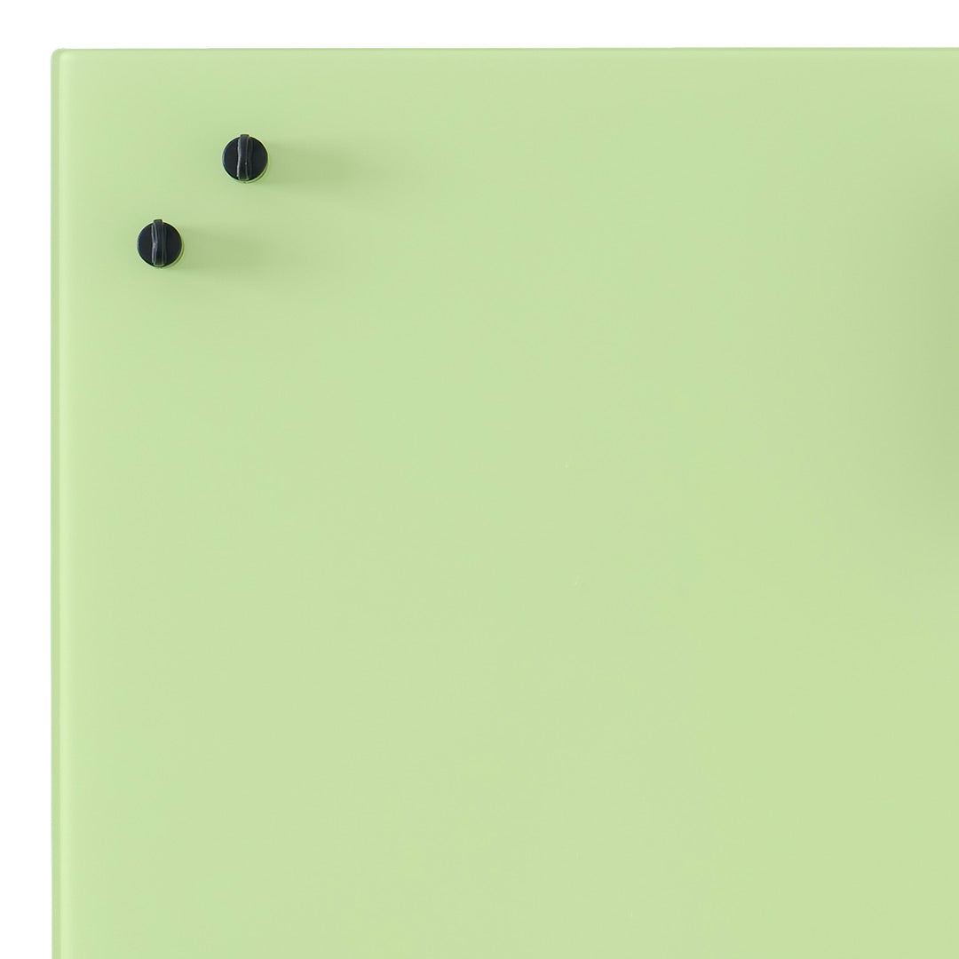 Light green surface with two black knobs, offering a minimalistic and modern aesthetic. Perfect for contemporary decor.