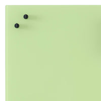 Light green surface with two black knobs, offering a minimalistic and modern aesthetic. Perfect for contemporary decor.