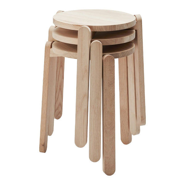 Light natural wood nest of stools with smooth round tops and sleek, minimalist legs. Ideal for modern decor.