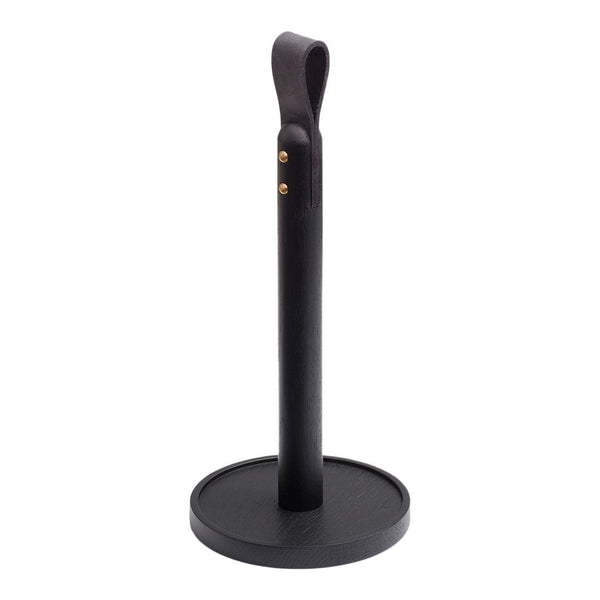 Black paper towel holder with a smooth leather texture and brass accents. Sleek and modern design.