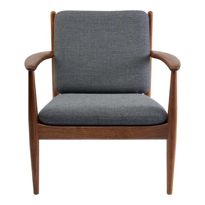Mid-century modern chair with a gray fabric cushion and natural wood frame. Simple, elegant design with no patterns.
