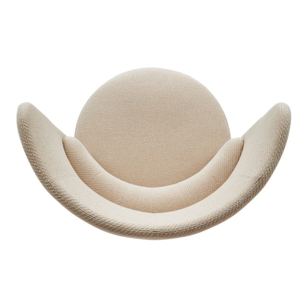 Beige curved chair with textured upholstery and a modern, minimalist design.