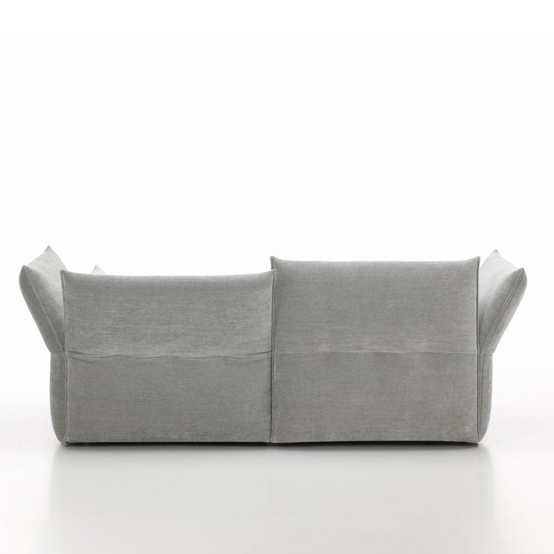 Gray fabric sofa with a smooth texture and minimalist design, featuring clean lines and no visible patterns.