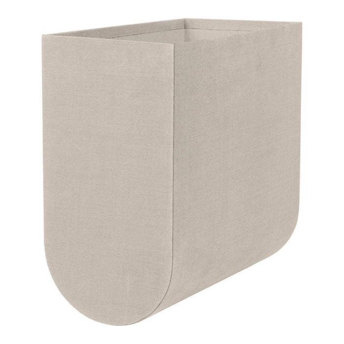 Light beige fabric storage bin with a smooth, minimalist design and rounded edges. Ideal for modern decor.