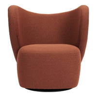 Rust-colored swivel chair with a smooth, modern upholstery and curvy, contoured design. Perfect for stylish living spaces.