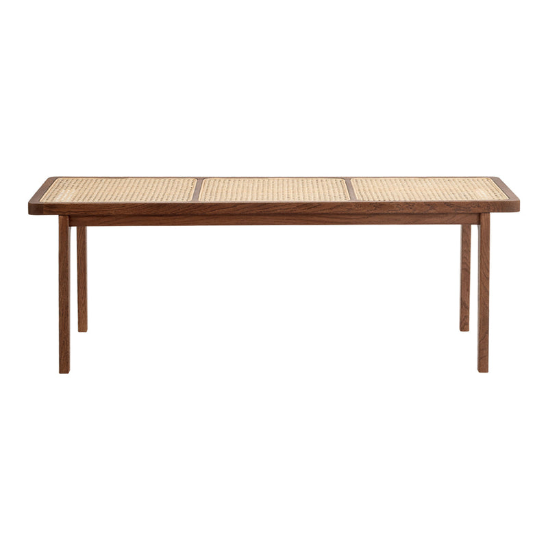 Natural wood table with a woven cane pattern top and smooth finish, featuring warm brown hues and a sleek rectangular design.