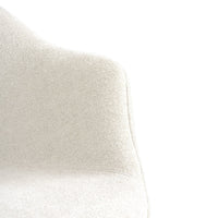 Cream-colored chair with a textured, soft fabric finish, ideal for modern decor.
