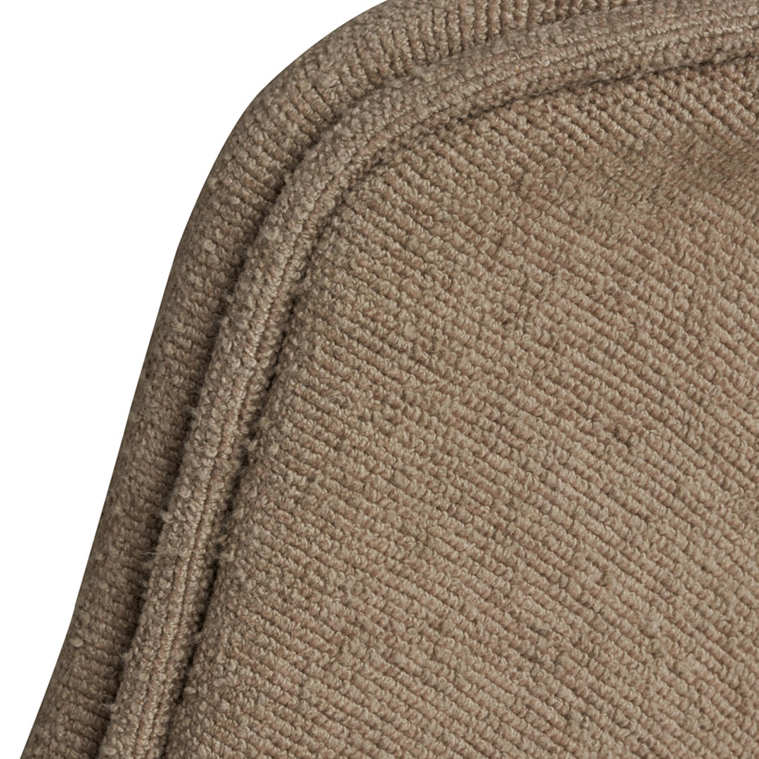 Textured beige fabric corner with subtle woven pattern, perfect for adding warmth to any space.