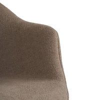 "Close-up of brown textured fabric upholstery on modern chair, showcasing a soft, muted color tone."