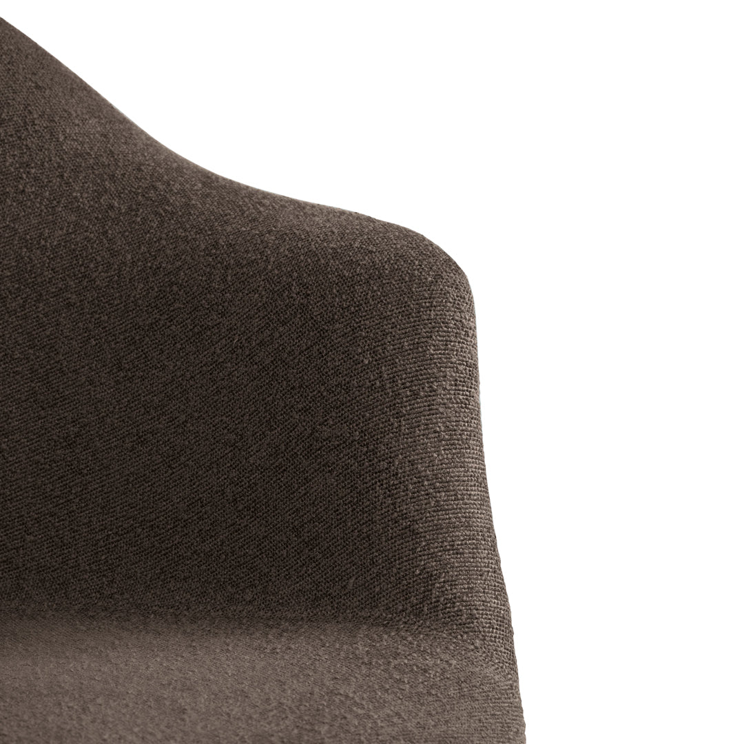 Textured brown chair with a smooth finish, showcasing deep earthy tones and subtle patterns. Perfect for modern decor.