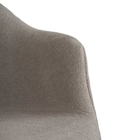 Soft grey upholstered chair with a smooth, textured finish, showcasing a modern, minimalist design.