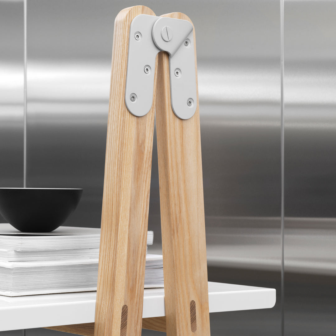 Light wood with a smooth finish, accented by sleek silver metal detailing. Modern design with minimalistic patterns.
