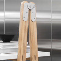 Light wood with a smooth finish, accented by sleek silver metal detailing. Modern design with minimalistic patterns.