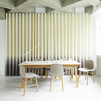 "Beige and cream gradient wall panel with subtle textured stripes in a modern dining setting."