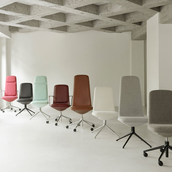 Colorful lineup of modern office chairs in pink, mint green, brown, white, gray, and light gray fabrics.