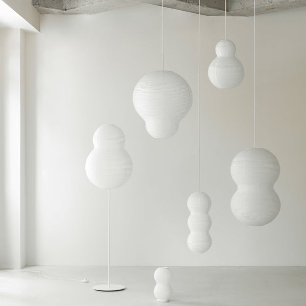White hanging decor in various bubble shapes and sizes against a minimalist light background. Ideal for modern interiors.