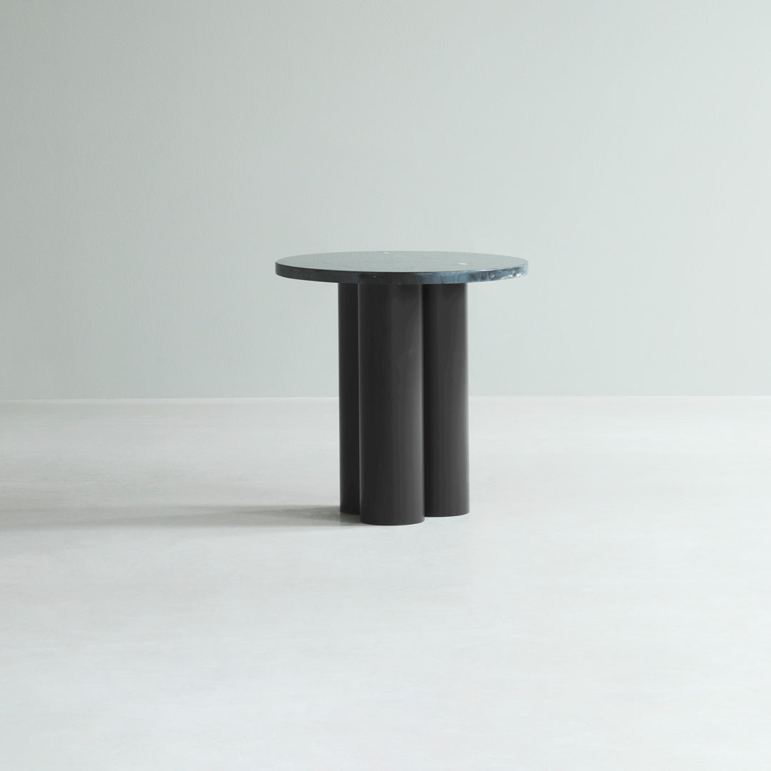 Round table with a smooth, blue-green top and matte black cylindrical legs, set against a light gray background.