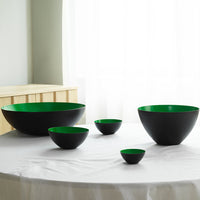 Set of five contemporary bowls featuring matte black exteriors and vibrant green interiors, showcasing a sleek, modern design.
