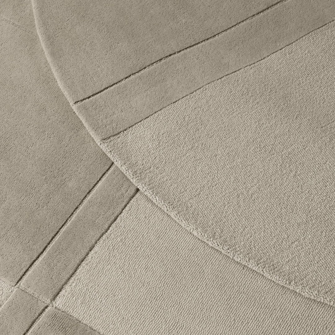 Beige area rug featuring soft textures and geometric patterns, perfect for elevating any living space.