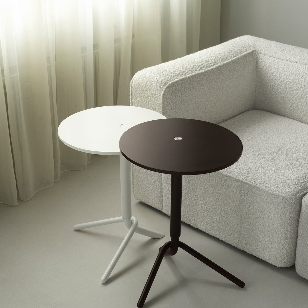 Set of two modern side tables in sleek white and dark brown finishes, featuring round tops and minimalist designs.