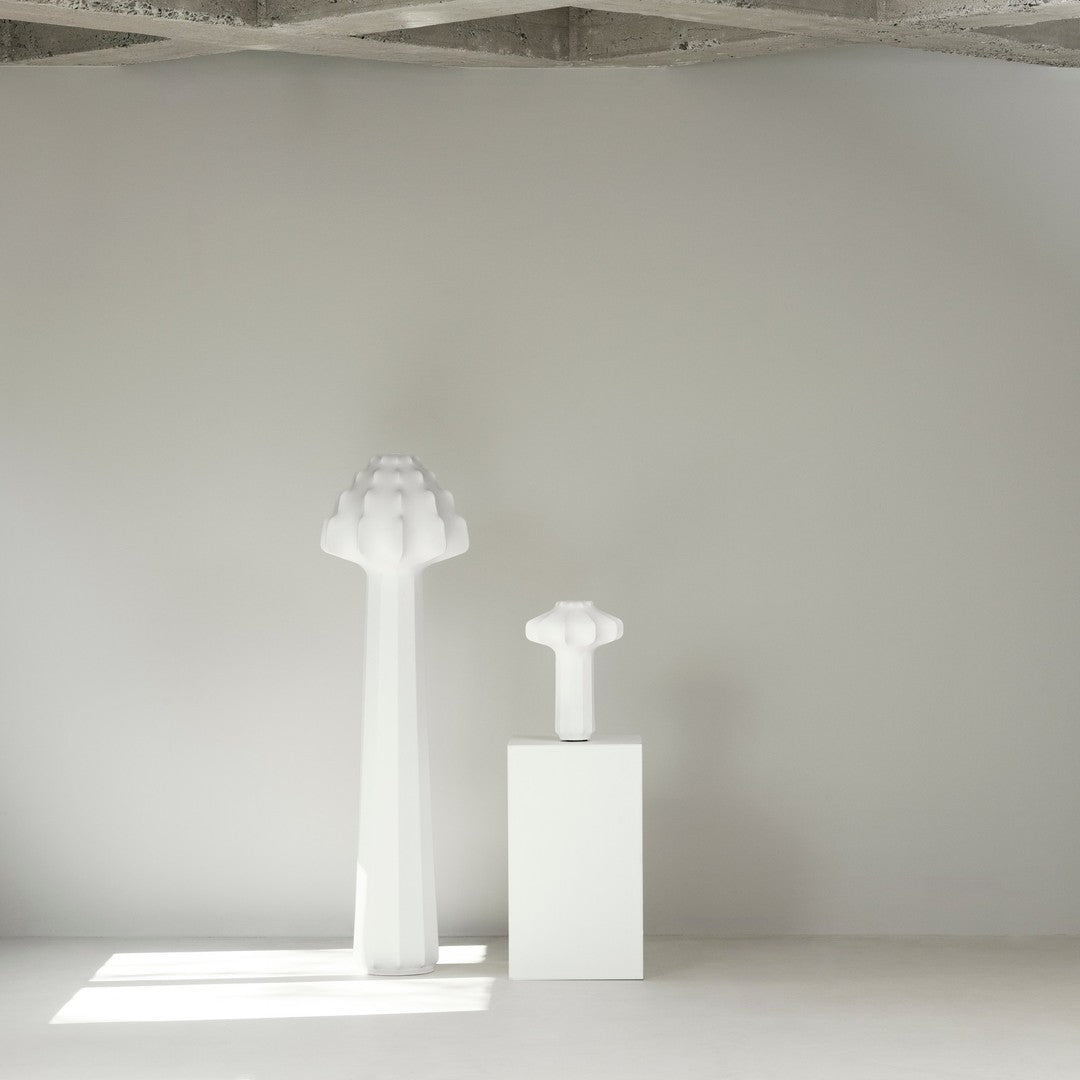 Stylish white lamp set featuring soft, rounded shapes and a minimalist design against a light gray background.