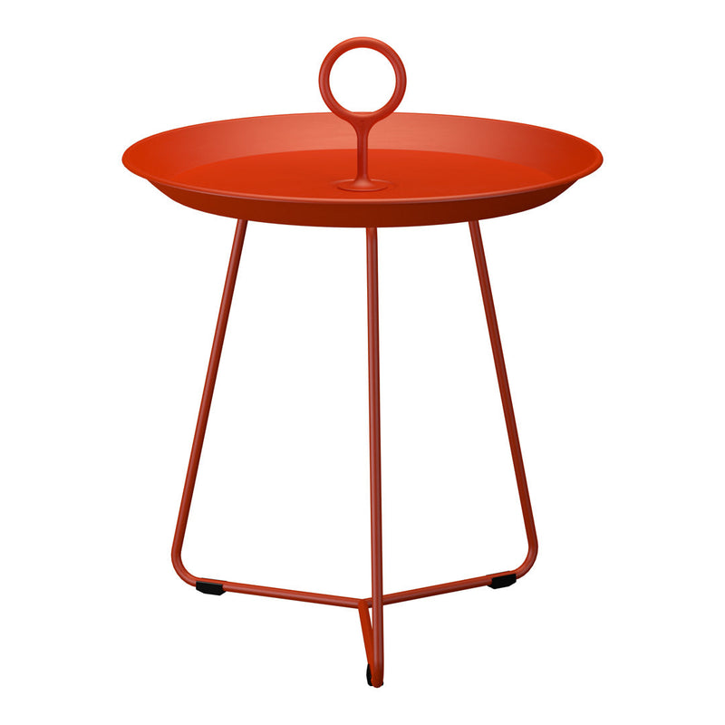 Bright orange round table with a handle and sleek metal legs, perfect for modern decor.