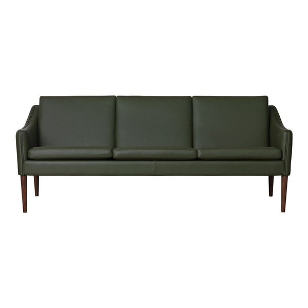 Green leather sofa with a sleek, modern design and wooden legs, featuring a clean, minimalist aesthetic.