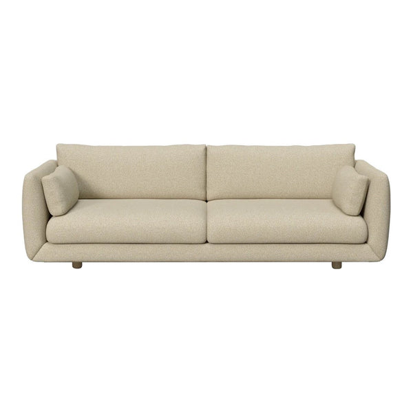 Modern beige sofa with a smooth fabric finish and minimalist design, featuring soft, rounded edges. 