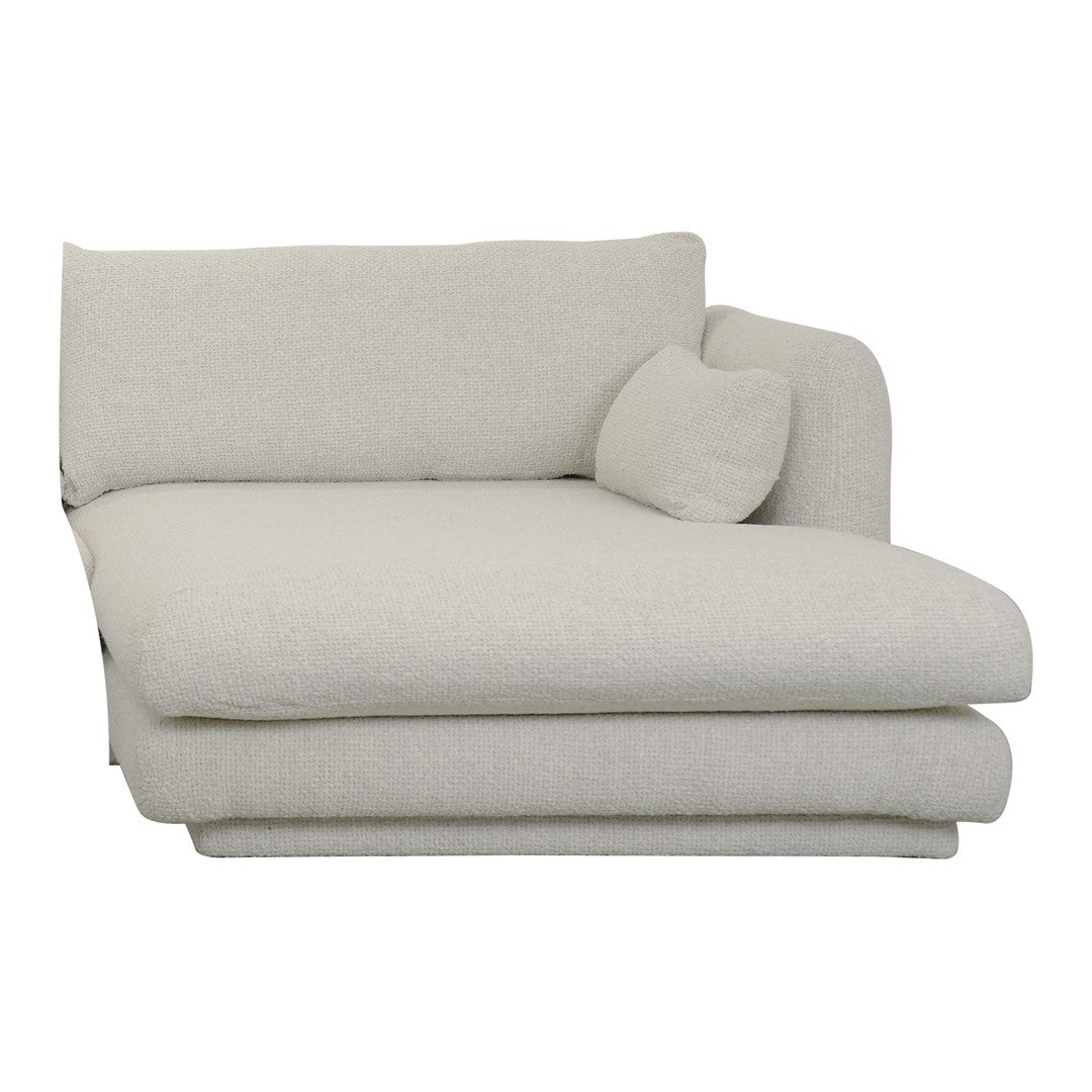 Light beige, textured fabric chaise lounge with a rounded cushion, creating a modern and cozy design.
