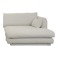 Light beige, textured fabric chaise lounge with a rounded cushion, creating a modern and cozy design.