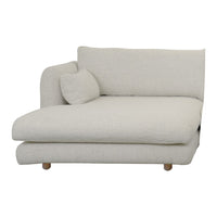 Light beige sectional sofa with a textured fabric and a round cushion, featuring a modern minimalist design.