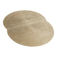 Beige spiral-patterned rug with two overlapping circular shapes, adding a modern touch to home decor.