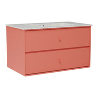 Coral pink dresser with a textured white countertop and simple drawer pulls, featuring a modern, minimalist design.