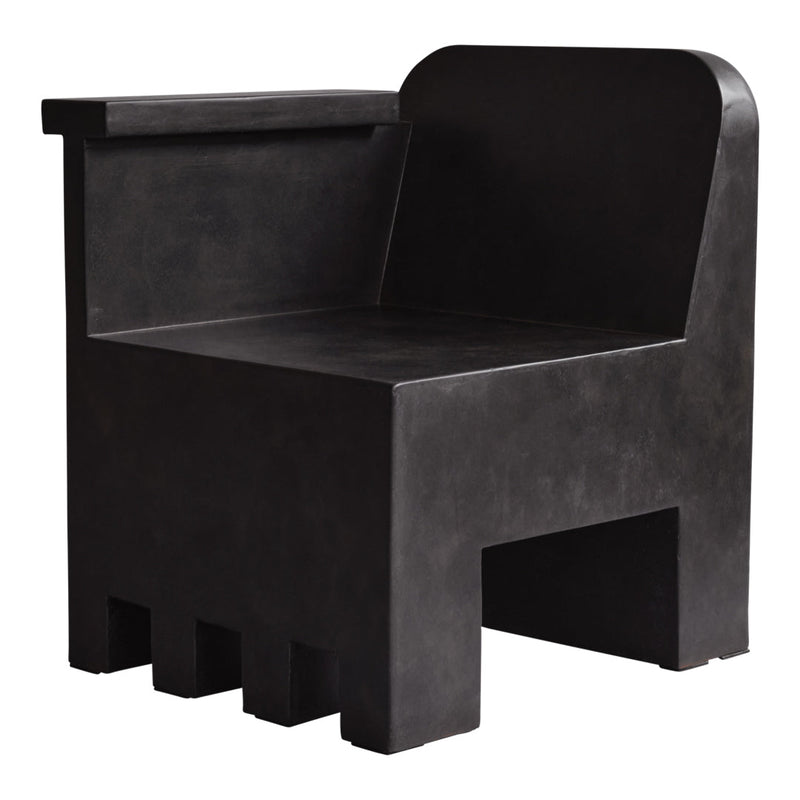 Black, minimalist chair with geometric patterns and smooth surfaces, perfect for modern decor.