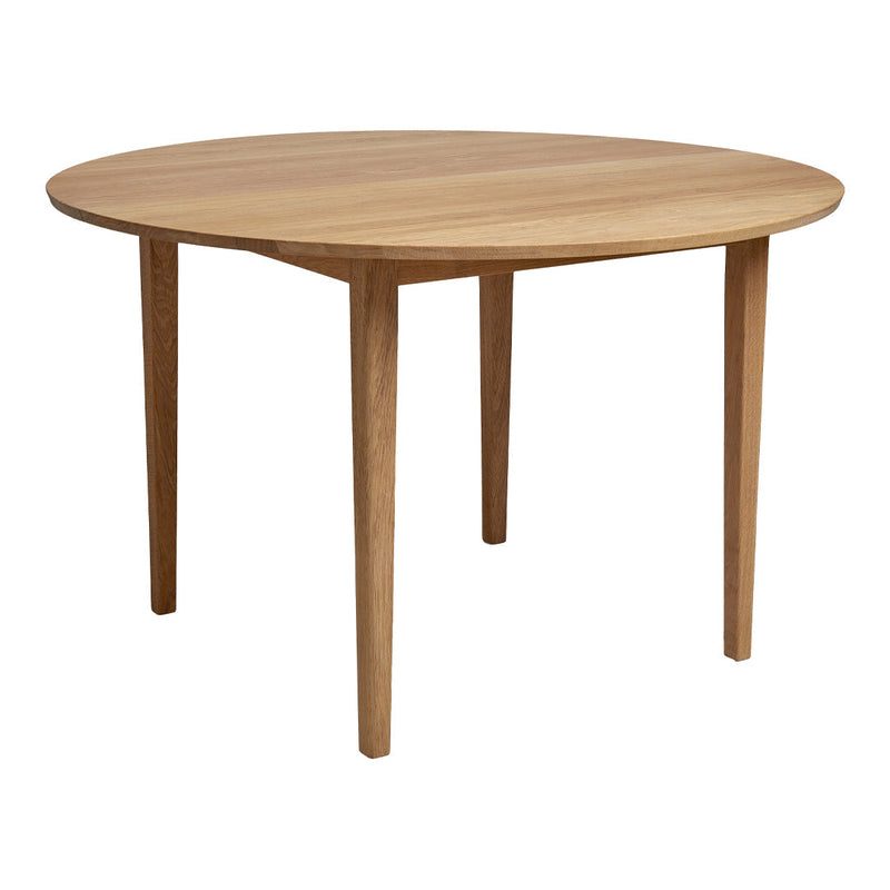 Light oak round table with a smooth finish and simple straight legs, showcasing natural wood grain patterns.