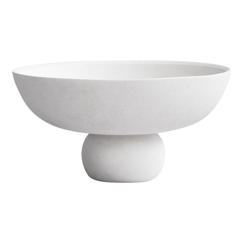 Elegant white bowl with a smooth, matte finish and rounded pedestal base, perfect for modern decor.