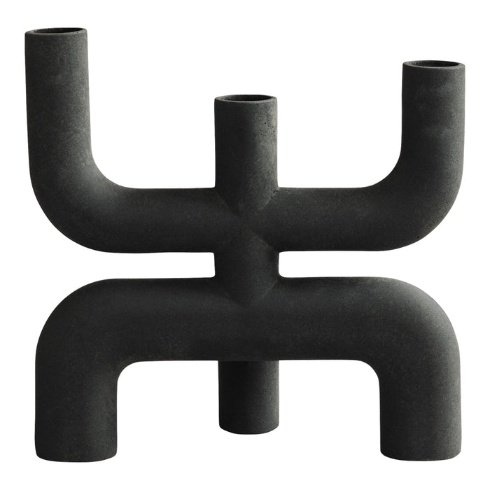 Black candlestick holder featuring a unique geometric design with multiple arms and a matte finish. Ideal for modern decor.